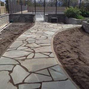 Best Kelowna Landscaper installing-stone-patio-walkways-and-fire-pit